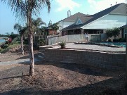 Seabrook, Texas, Retaining Wall, Drainage system, Outdoor Lighting, Brick Pavers, Steps, Raised Patio, Bench Seating, Pool Surrounding, Landscaping
