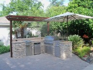 Houston, Texas outdoor kitchen, Brick Paver Patio, Retaining Wall, Drainage System, Fire Pit, Pergola