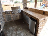League City, Texas outdoor kitchen, Brick Paver Patio, Retaining Wall, Drainage System, Fire Pit, Pergola