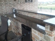 Pearland, Texas Outdoor Kitchen Retaining Wall, Step System, Brick Paver Patio, Drainage System, Fire Pit, Fire Place